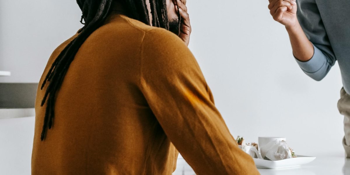 Societal expectations often lead men to manifest mental health symptoms like irritability or a 'robot-like' disconnectedness, differing from typical presentations.