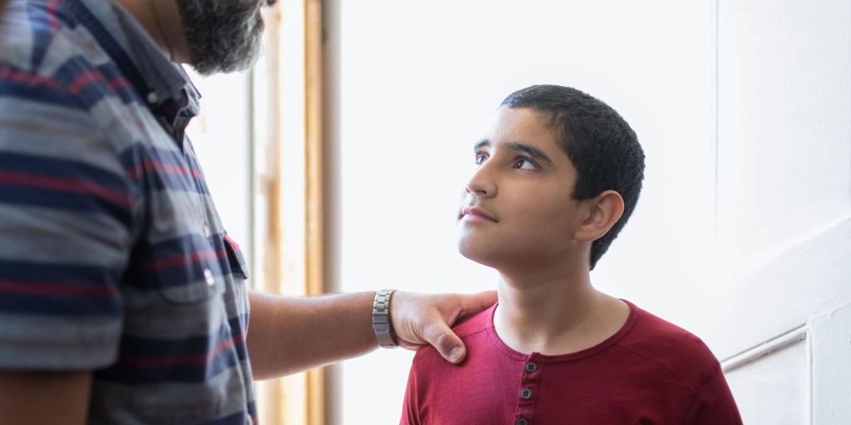 A parent shows support and understanding to a child expressing worry.