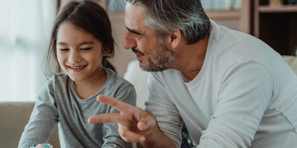 A therapist engages a child in play, a key action-oriented approach in therapy.
