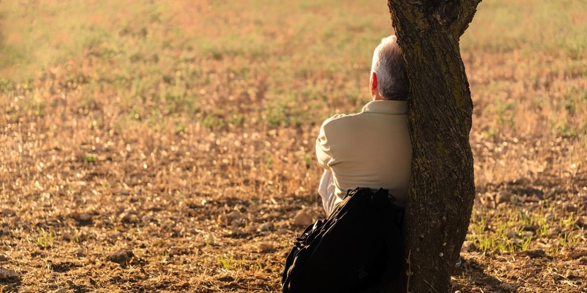 A man reflecting on deep sadness after a breakup, highlighting the hidden emotional toll.