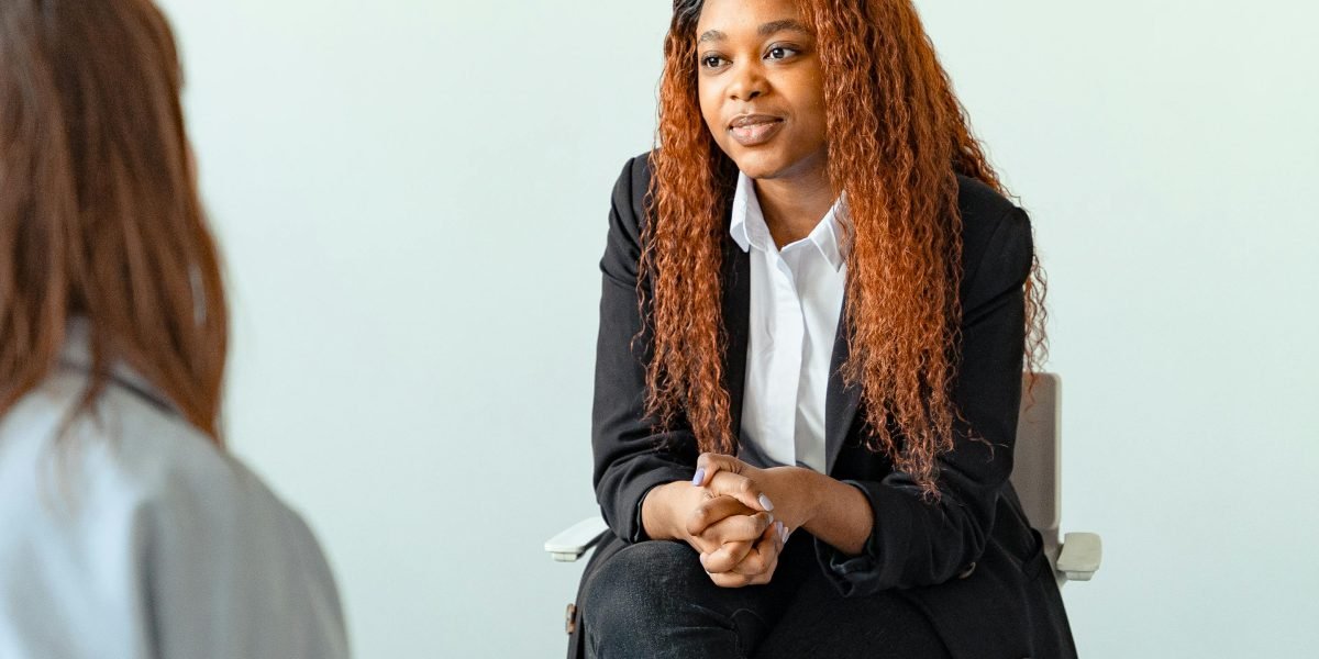 A professional actively listening with empathy, symbolizing the supportive role of a clinical mental health counselor.