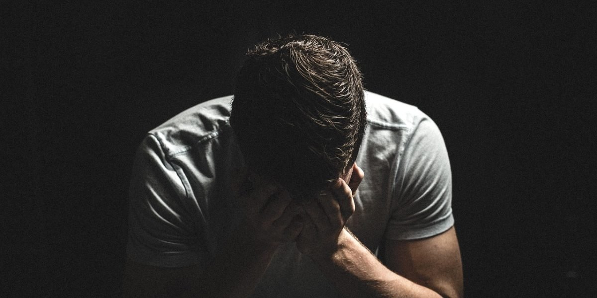 A man reflecting feelings of isolation and disconnection.