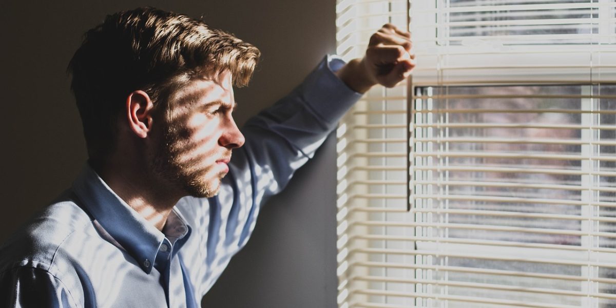 A man in deep thought, reflecting on personal challenges and seeking a path to hope and healing.