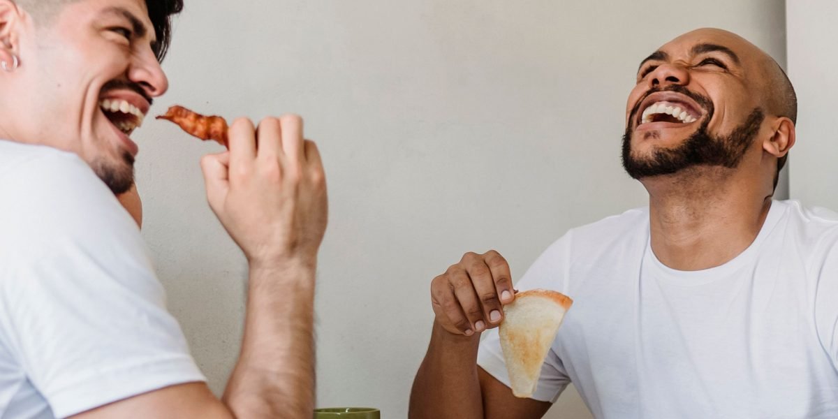 Men engaged in an open and supportive conversation, symbolizing the strength found in embracing vulnerability.