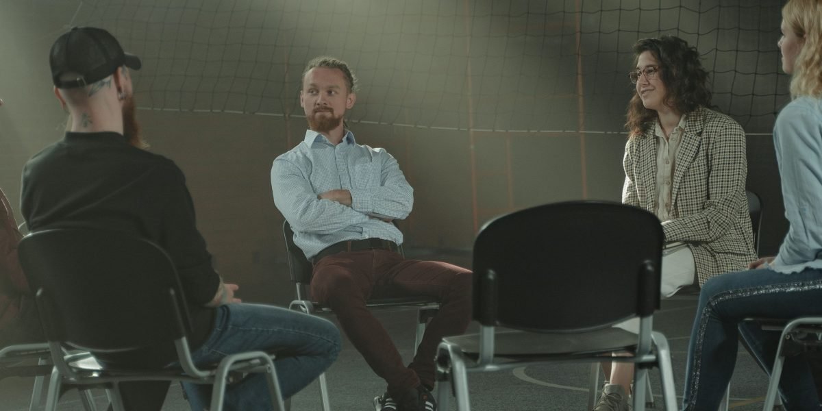 In group therapy, men can find a supportive peer network, sharing struggles and building mutual understanding in a safe, non-judgmental space.