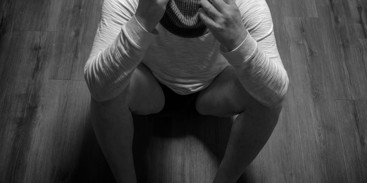A man in a moment of quiet reflection, conveying feelings of loneliness and introspection.