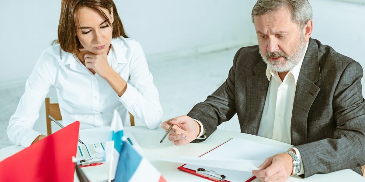 A counselor actively listening and guiding a client in a supportive, professional setting, fostering understanding.