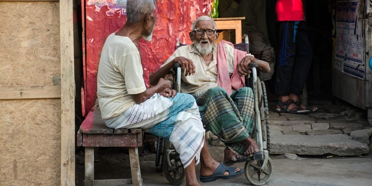 Two men engaged in a serious and open conversation, illustrating the importance of male friendships and support.