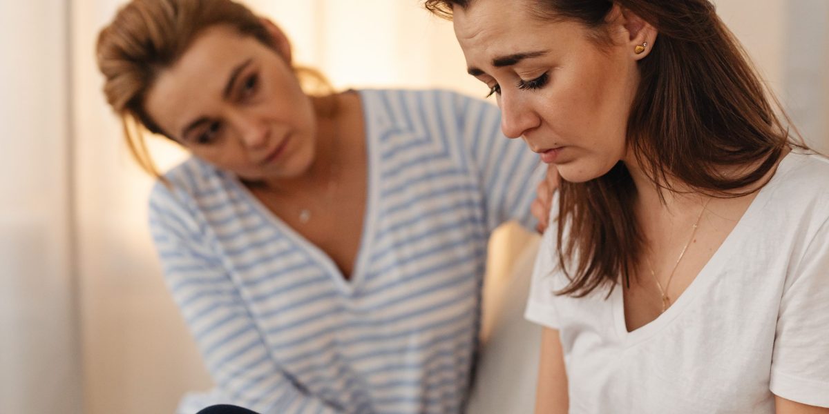 A support group member shares, and others respond with understanding and encouragement.