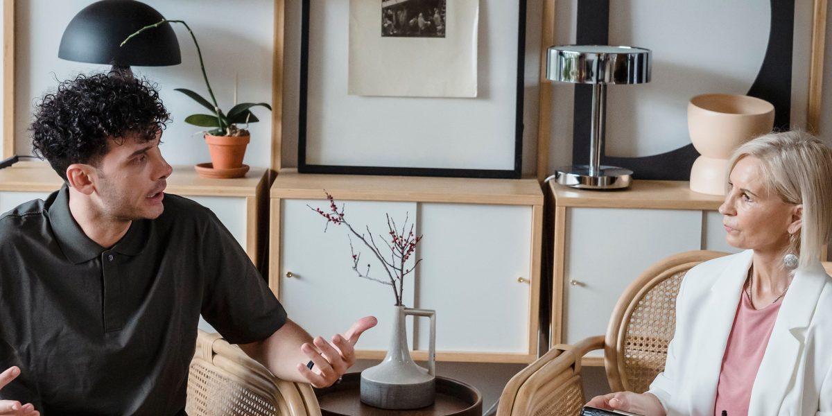 A man engages in open conversation with a mental health professional, overcoming stigma.