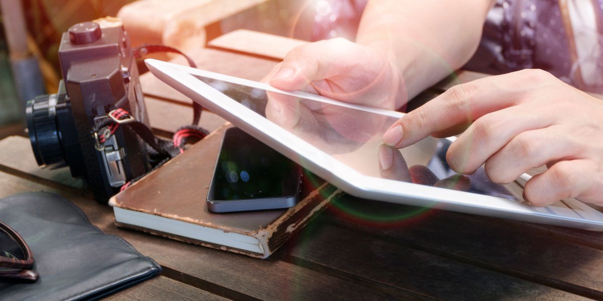 A person uses a laptop or tablet to search for local or virtual support groups, demonstrating proactive help-seeking.