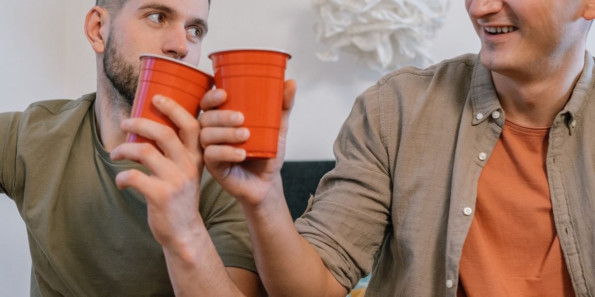 Men participate in a support group, openly sharing their experiences and building connection in a male-friendly environment.